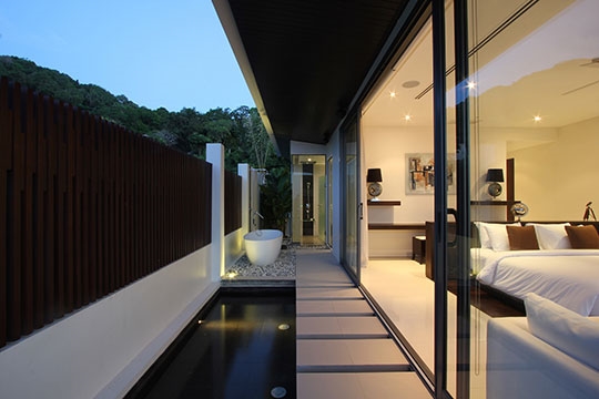 Master bedroom outdoor tub area in the evening